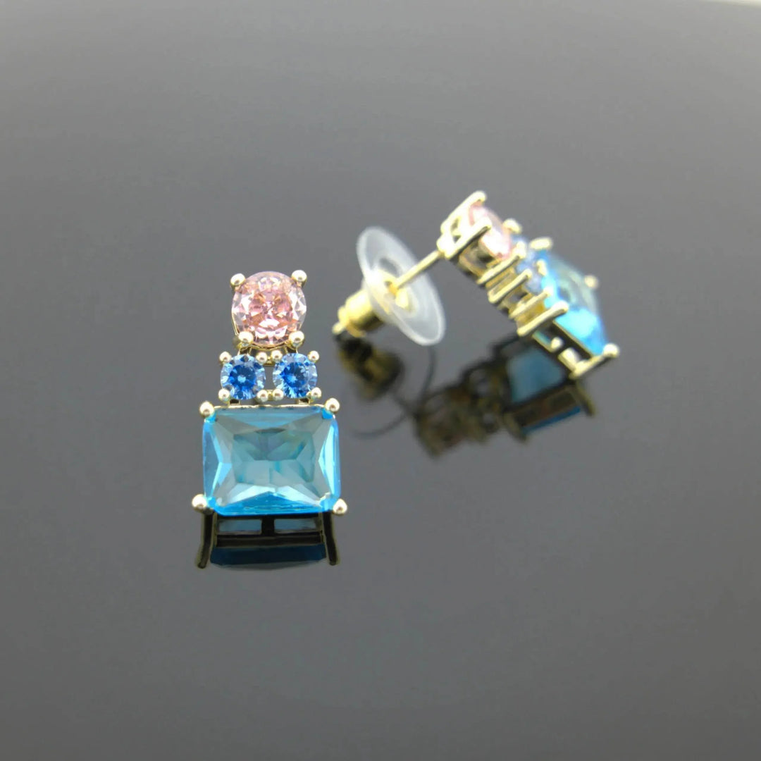 Gold-colored earrings with pink and blue zirconias